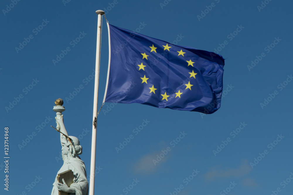 Statue of Liberty and european union against blue sky