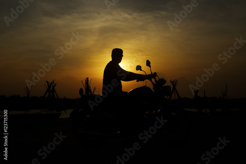 Silhouette man with Bike