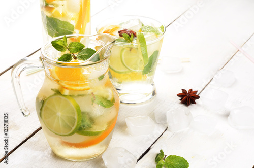 Jug with Lime and Orange Fruit Water with ice