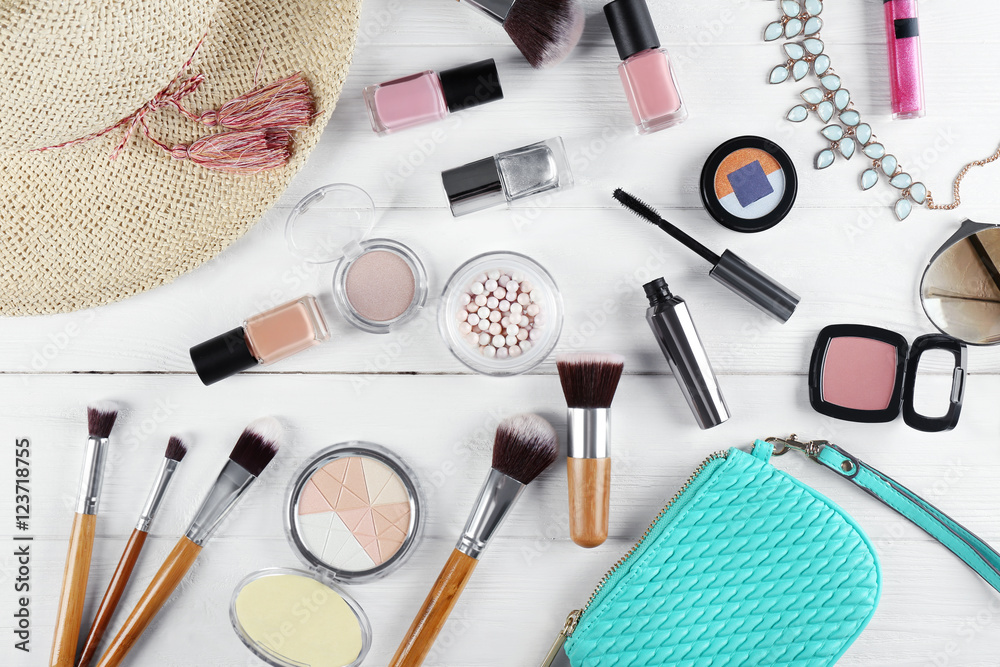Flat lay of women cosmetics and accessories on white wooden background Flat lay of women cosmetics and accessories on white wooden background
