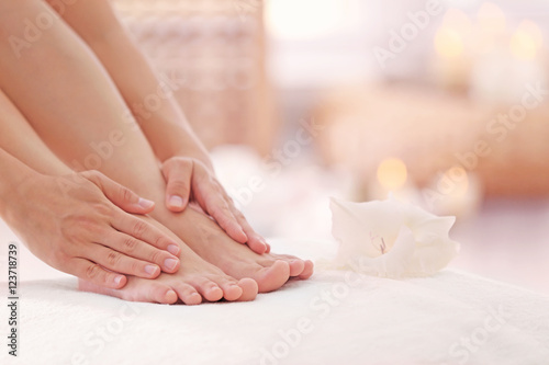 Fototapeta Naklejka Na Ścianę i Meble -  Female feet in spa salon, closeup