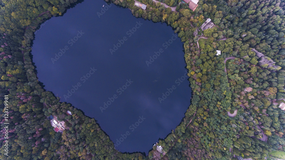 aerial drone bird eye view of lake inside volcano