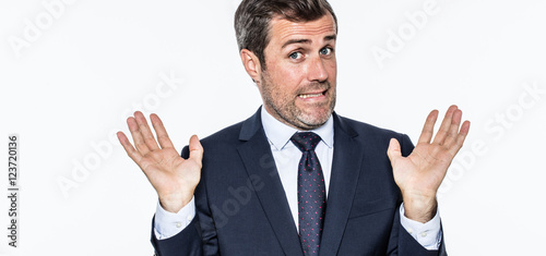 smiling careless bearded businessman refusing accusation, acting like an hypocrite