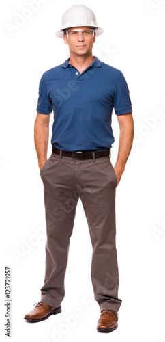 Engineer Architect in blue polo shirt with Hands in Pockets isolated on white background