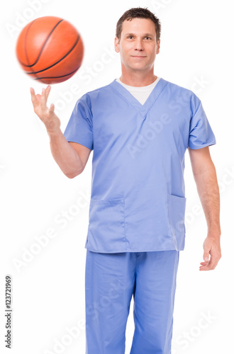 Othopedic surgeon sports medicine doctor physical therapist in scrubs with NBA basketball isolated on white background