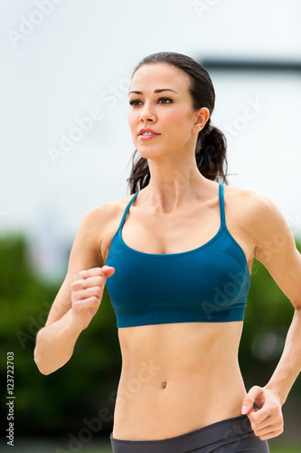 Young Woman Running Jogging in Urban Environment