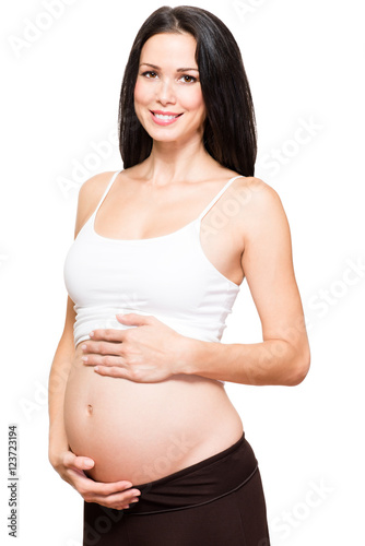 Pregnant woman holding belly isolated on white background © Eric Hood
