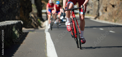 Cyclist athletes riding a race at high speed