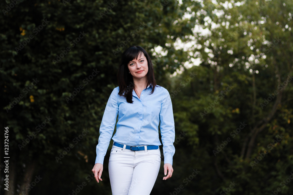 Beautiful woman walk in the park Beautiful woman walk in the park
