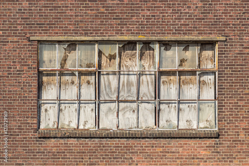 Broken window of a derelict warehouse