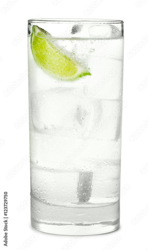 Tall highball gin and tonic cocktail sparkling water soda with lime