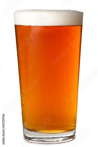 Платно Foamy head pint glass of amber beer ale lager isolated on white background