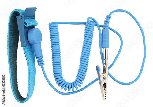 Antistatic wrist strap or ground bracelet is an antistatic device used to safely ground a person working on very sensitive electronic equipment. Object is isolated on white background without shadows. photo