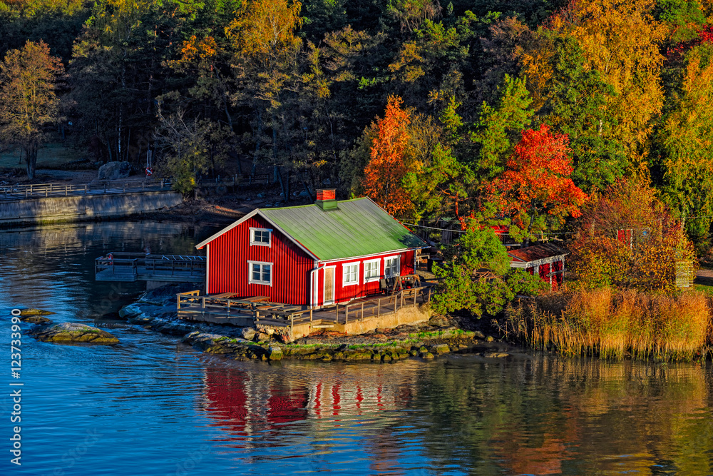 Red house on rocky shore of Ruissalo island, Finland Red house on rocky shore of Ruissalo island, Finland