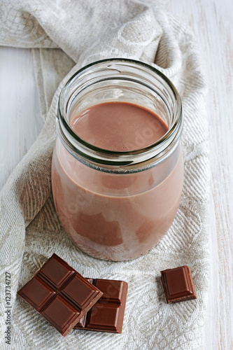 Chocolate milk with pieces of chocolate bar