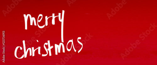 Postcard for Christmas time handwritten "Merry Christmas" whishes © aniphaes
