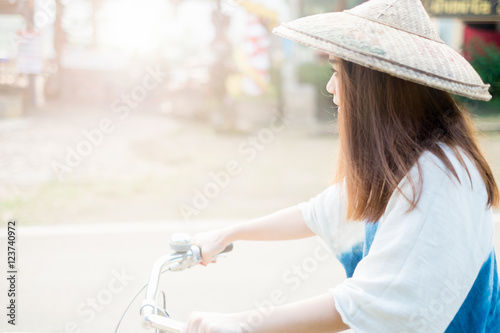 Portrait of a beautiful asian woman with a bicycle photo