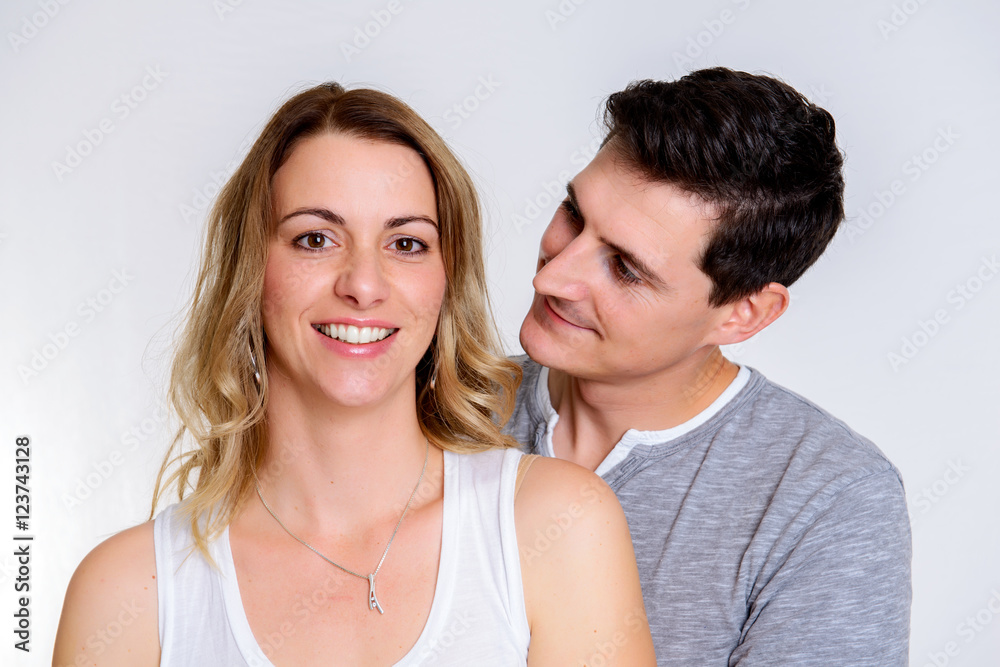 young couple in front of white background