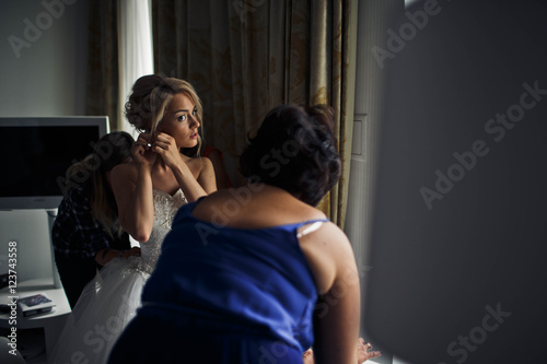 young woman  wearing beautiful earring © nastasenko