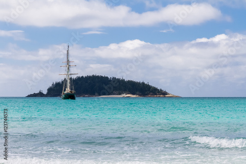 Sailing Ship at beautiful beach in the Whitsunday Islands in Australia photo