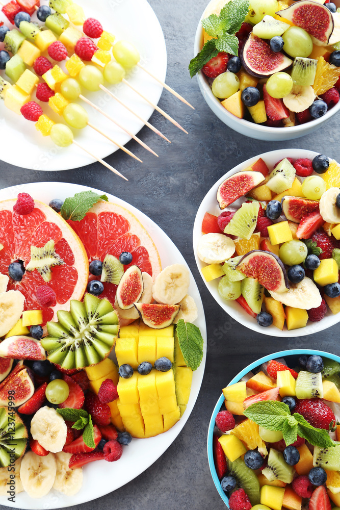 Fresh fruit salad on a grey wooden table Fresh fruit salad on a grey wooden table
