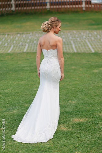 Blonde bride in the gorgeous wedding dress