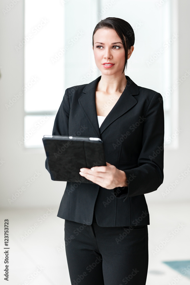 Businesswoman with Digital Tablet Computer in Modern Office