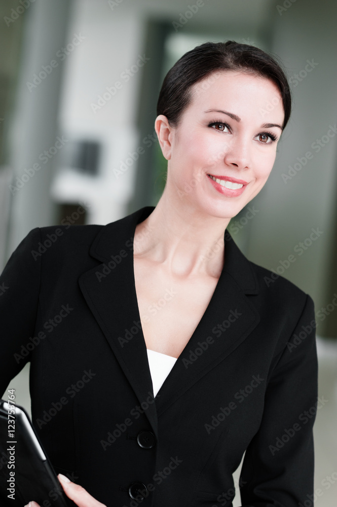 Businesswoman with Digital Tablet Computer in Modern Office Businesswoman with Digital Tablet Computer in Modern Office