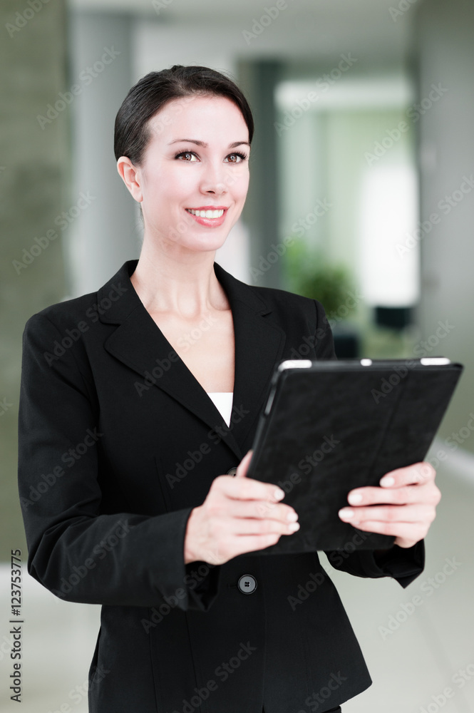 Businesswoman with Digital Tablet Computer in Modern Office Businesswoman with Digital Tablet Computer in Modern Office