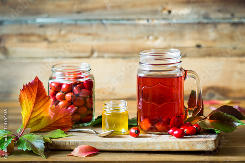 Rosehip tea and berries with honey