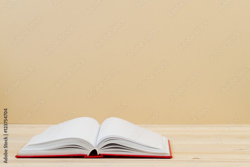 Open book, stack of hardback book on wooden table. Back to school. Copy space. Top view Open book, stack of hardback book on wooden table. Back to school. Copy space. Top view