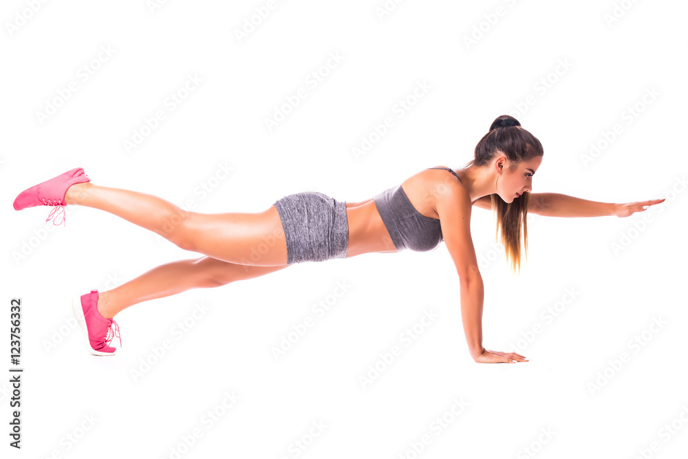Bird Dog Plank. Young woman doing sport exercise.