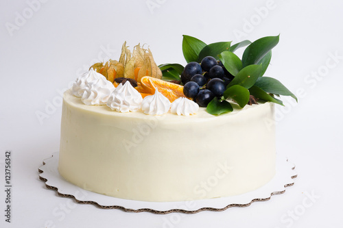 Vanilla cream cheese cake with grapes and oranges photo