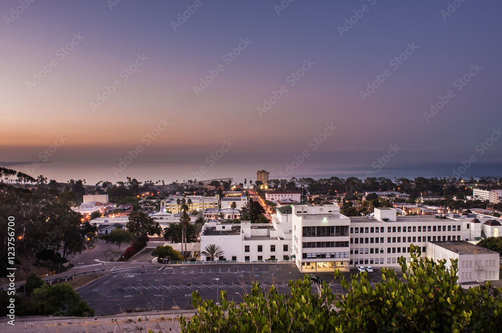 Night lights of Ventura glow under the predawn sky.