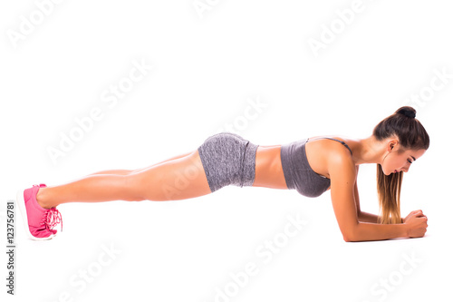 Elbow Plank. Young woman doing sport exercise.