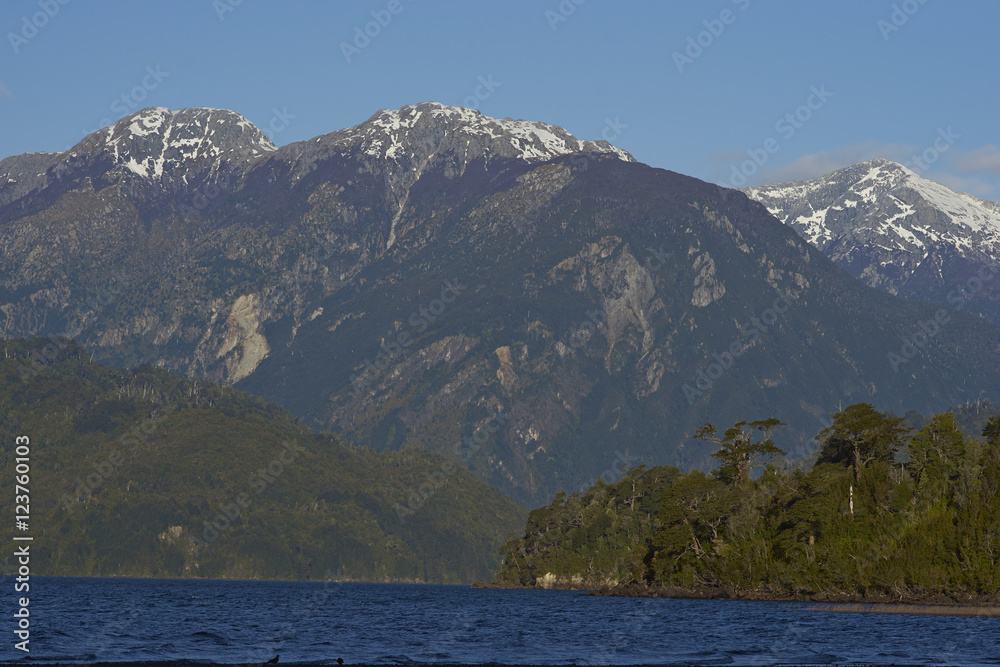 Lago Yelcho in the Aysen Region of southern Chile. Large body of fresh water surrounded by lush forest and snow capped mountains.  