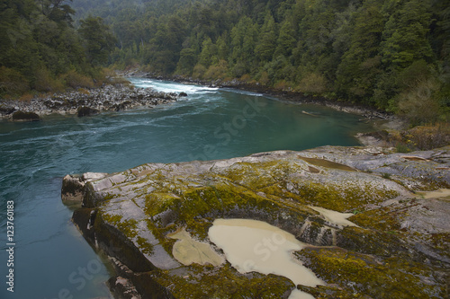 River Futaleufu flowing through mist shrouded forests in the Aysen Region of southern Chile. The river is renowned as one of the premier locations in the world for white water rafting. photo