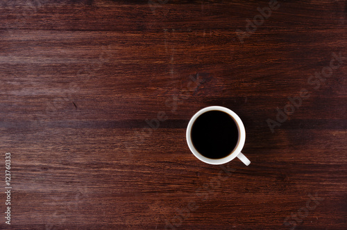 Cup of coffee on dark table