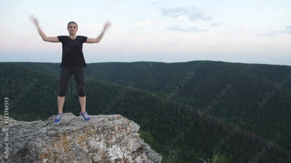 female exercisers on the top of the mountain female exercisers on the top of the mountain