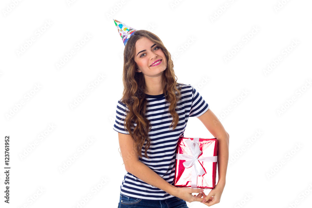 Woman in celebration cap holding a present Woman in celebration cap holding a present