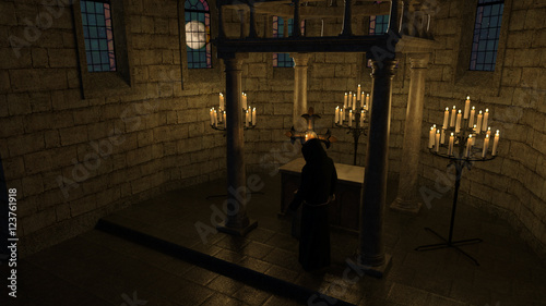 Monk - priest - in front of the cross in the chapel