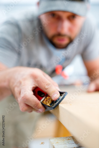 Wallpaper Mural Carpenter using a hand plane Torontodigital.ca