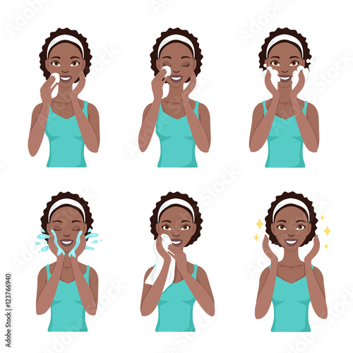 Attractive pretty young black woman dressed in casual t-shirt remove make-up, clean, wash and care her face with sponge. Facial treatment procedures, african american, healthy lifestyle.