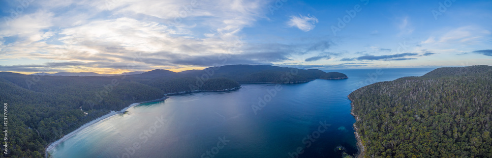 Aerial panorama of Fortescue Bay at sunset. Tasman National Park, Victoria, Australia