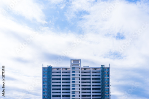 Real estate image  tower apartment building against blue sky