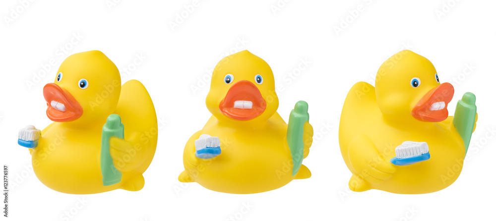 Set of rubber duck with toothpaste toothbrush. Isolated on white Set of rubber duck with toothpaste toothbrush. Isolated on white