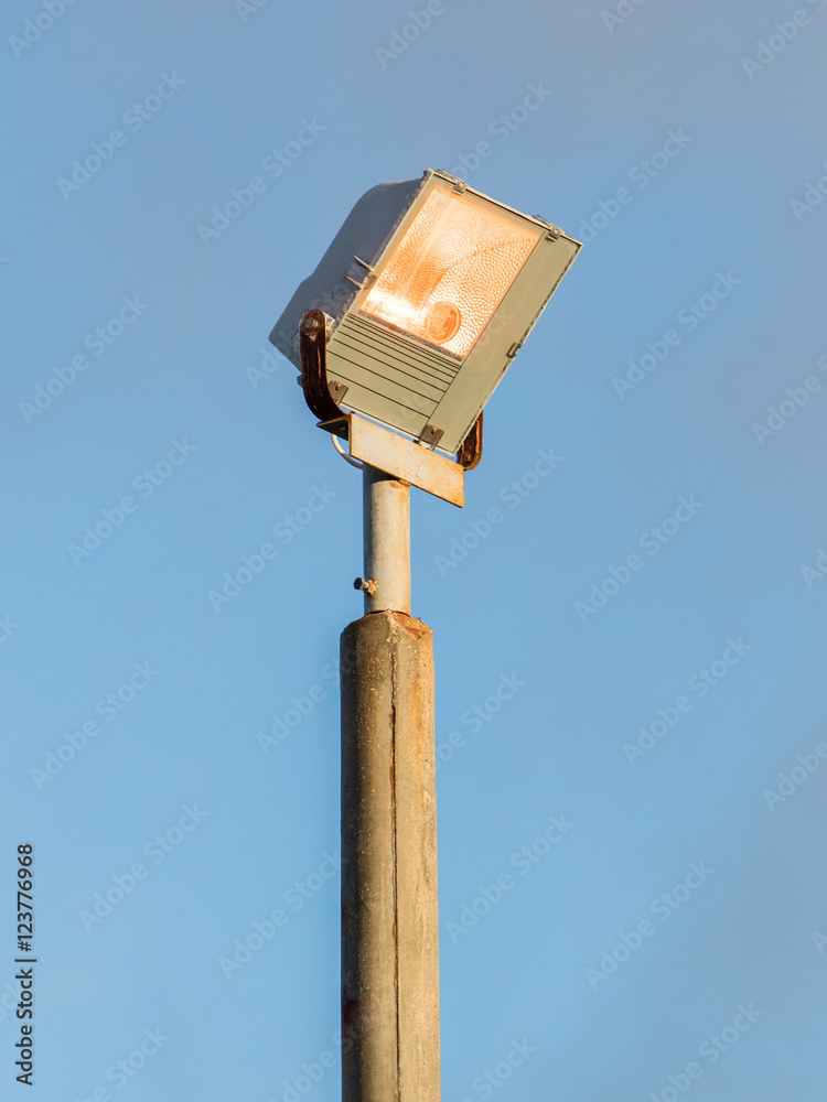 Security light against blue sky Security light against blue sky