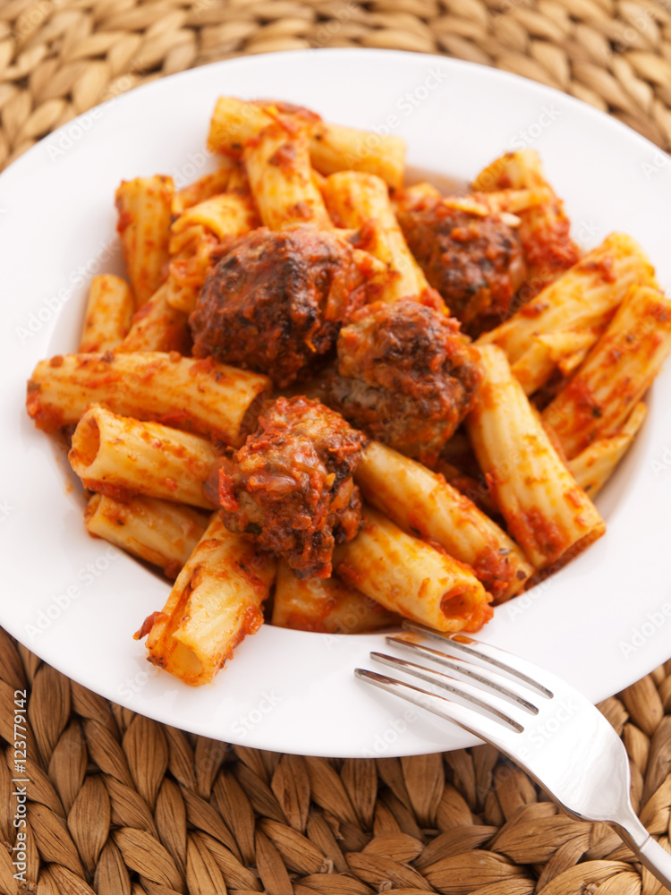Itailian penne pasta with meatballs and tomatoes sauce Itailian penne pasta with meatballs and tomatoes sauce