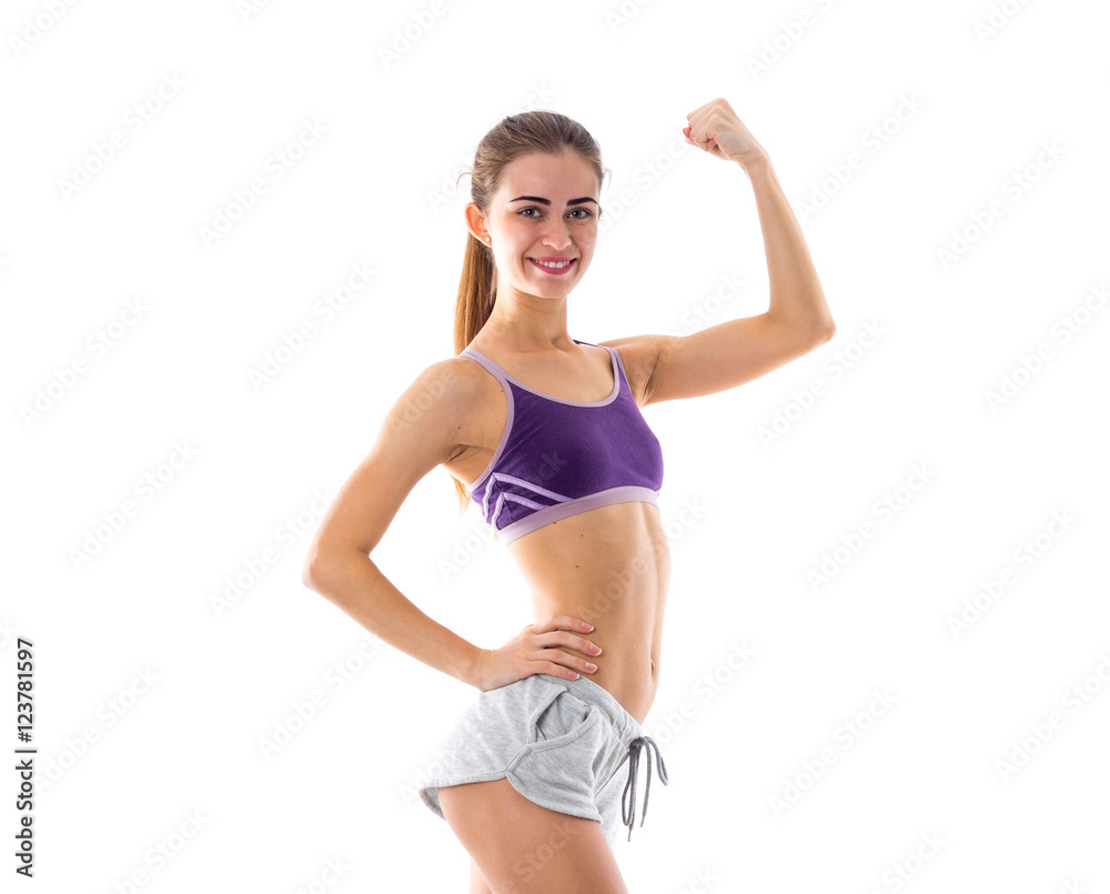 Fototapeta premium Athletic woman showing her biceps