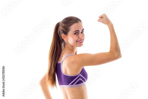 Athletic woman showing her biceps